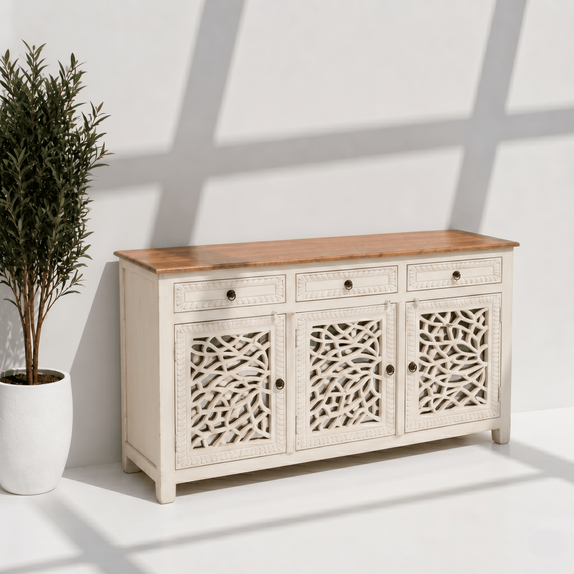 Elegant white wooden storage cabinet with decorative cutwork