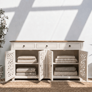 Elegant white wooden storage cabinet with decorative cutwork