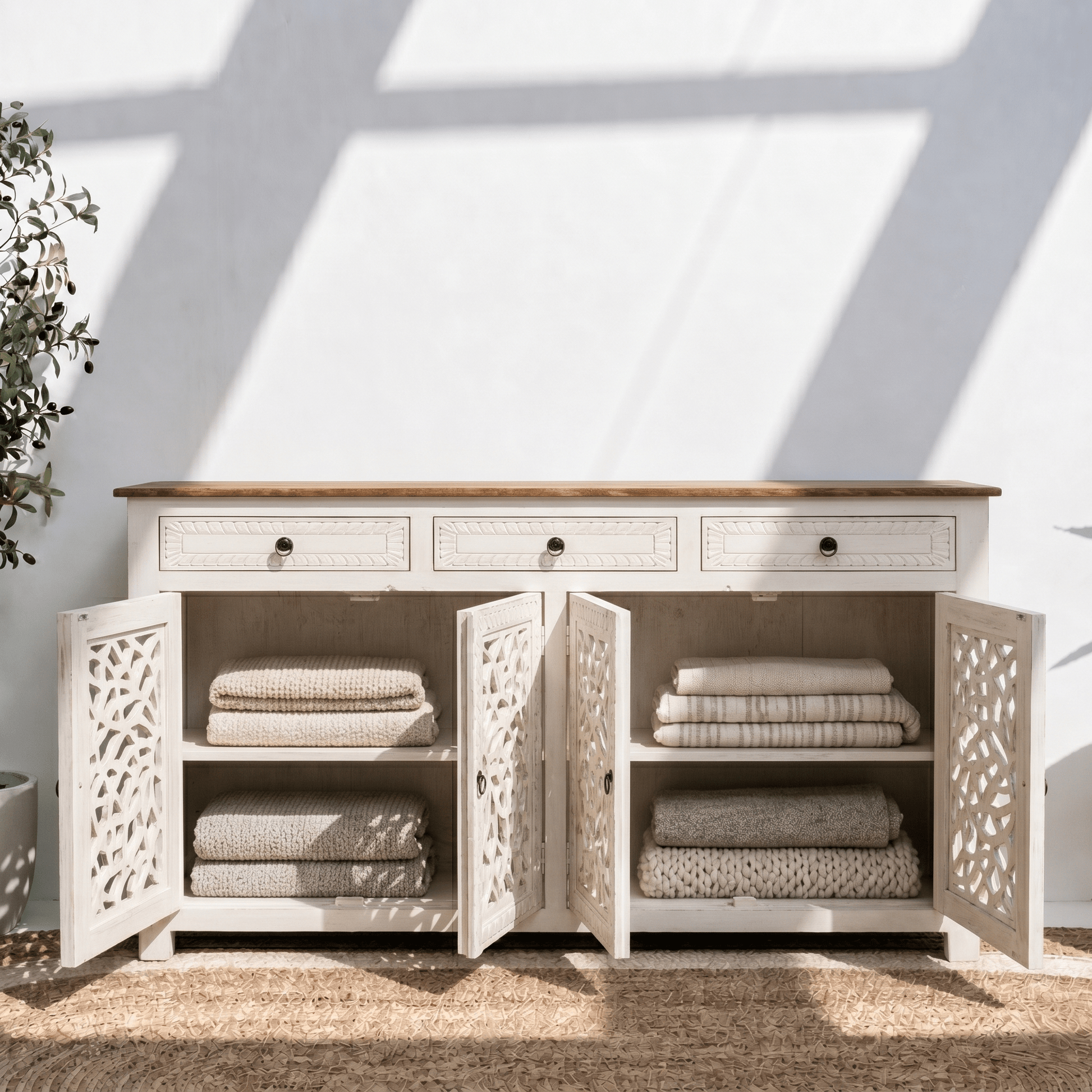 Elegant white wooden storage cabinet with decorative cutwork