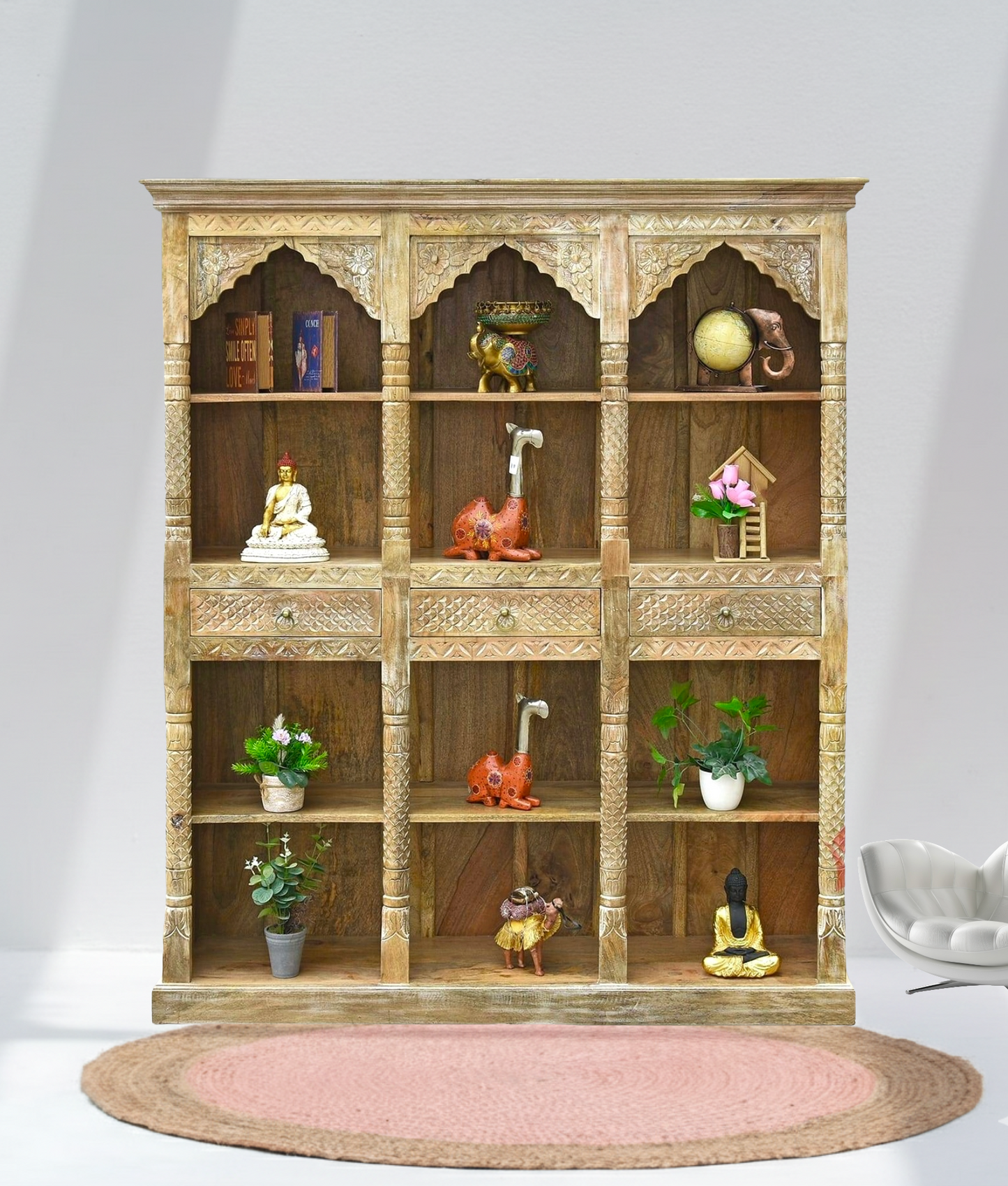 Decorative wooden shelf with various items against a white wall